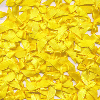 Satijnen strikjes geel (ca. 100 stuks)